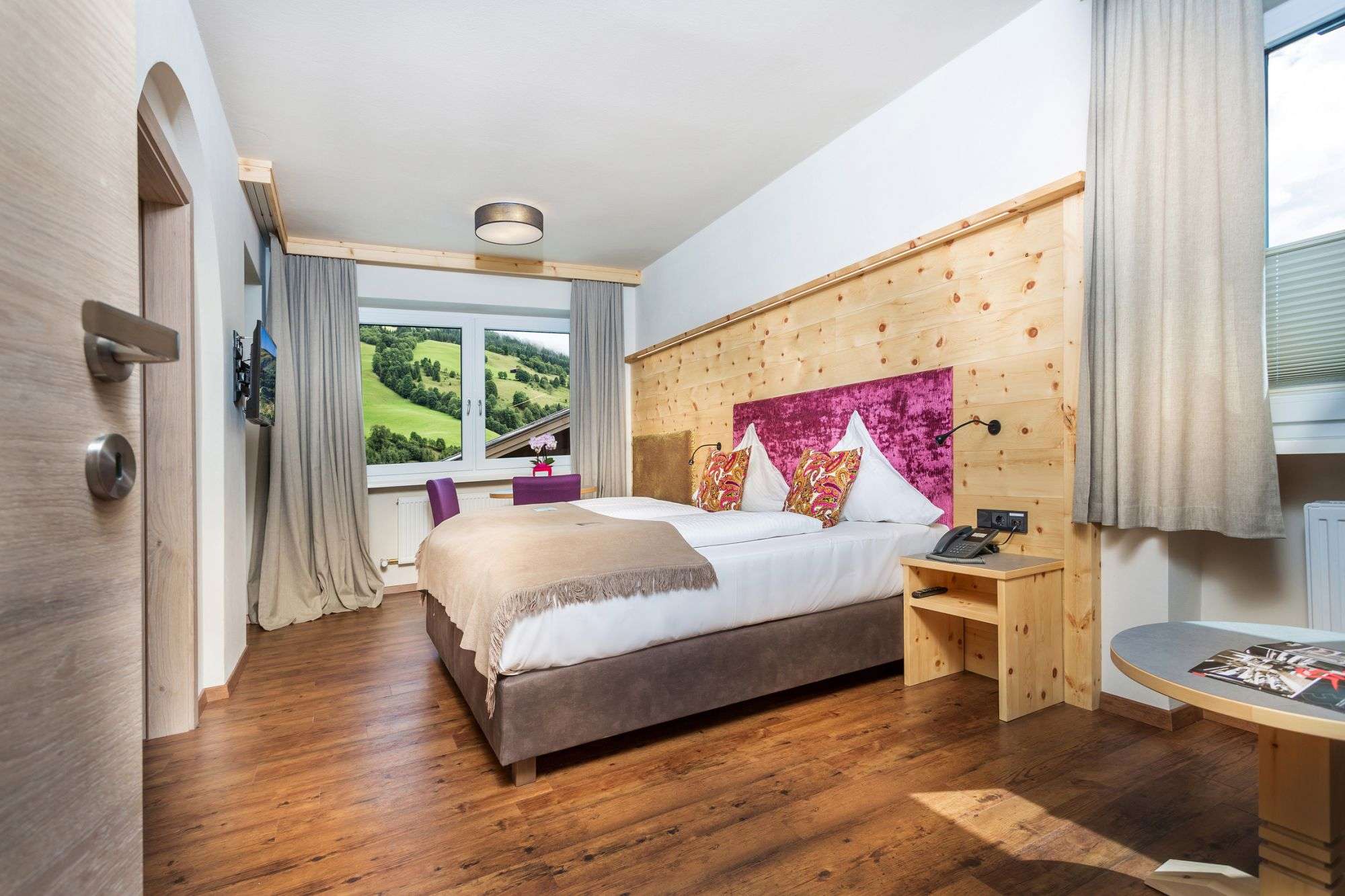 Swiss stone pine room in Hotel Talblick with mountain view
